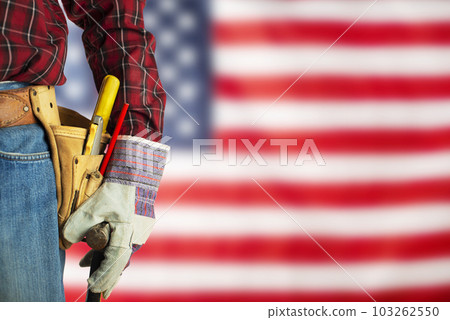 Worker in gloves and toolbelt on us flag background labor day mockup 103262550