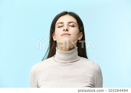 portrait of a beautiful young caucasian woman, eyes closed, smelling fragrance in the air, portrait of a beautiful young caucasian woman, eyes closed, smelling fragrance in the air, 103264494