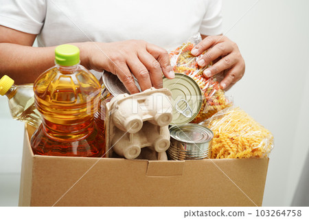 Foodstuffs in donation box for volunteer to help people. 103264758