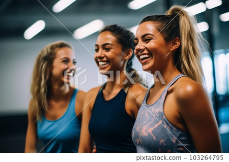 Fun in fitness clothing. Three female friends laughing happily in a gym. Generative AI 103264795