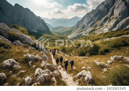 A thrilling shot of a group of hikers trekking through the rugged terrain of a Croatian national park, with majestic mountains in the background. Generative Ai A thrilling shot of a group of hikers trekking through the rugged terrain of a Croatian national park, with majestic mountains in the background. Generative Ai 103265545