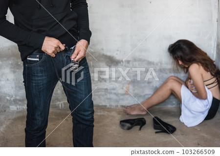 Thief man wearing pants after violence sexual rape young woman at abandoned house, robber criminal concept 103266509