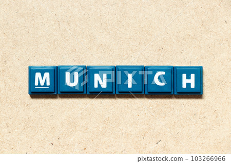 Tile alphabet letter in word munich on wood background Tile alphabet letter in word munich on wood background 103266966