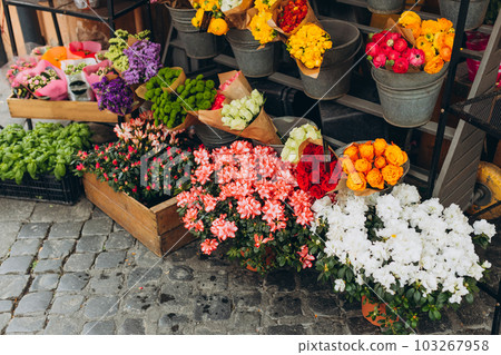 Street flowers store for retail sell. Small business concept. Flower market with various multicolored fresh bouquet, holiday banner Street flowers store for retail sell. Small business concept. Flower market with various multicolored fresh bouquet, holiday banner 103267958