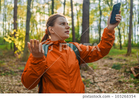 No signal cellphone network. No communication coverage, lost contact signal device. Sad woman tourist hiker hand holding smart phone searching signal. Communication, cellular problem, bad connection 103268354