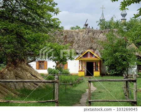The Museum of Folk Architecture and Everyday Life of the Middle Dnieper region showcases an aged Ukrainian house. 103269045