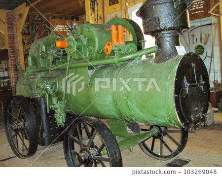 One old steam locomotive, an ancient steam engine. 103269048