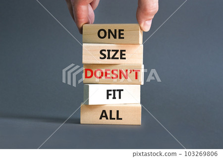 One size does not fit all symbol. Concept words One size does not fit all on wooden blocks. Businessman hand. Beautiful grey background. One size does not fit all business concept. Copy space. One size does not fit all symbol. Concept words One size does not fit all on wooden blocks. Businessman hand. Beautiful grey background. One size does not fit all business concept. Copy space. 103269806