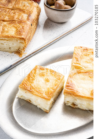 Turkish Pastry for Breakfast Su Boregi, on gray concrete table background 103270185