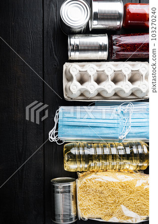 Contactless social home delivery, safe shopping in coronavirus pandemic or donation, top view with copy space, on black wooden table Contactless social home delivery, safe shopping in coronavirus pandemic or donation, top view with copy space, on black wooden table 103270240