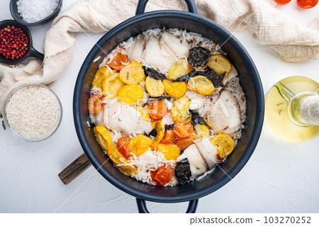 White tilapia fish with basmati rice and cherry tomatoes , on white background, top view White tilapia fish with basmati rice and cherry tomatoes , on white background, top view 103270252