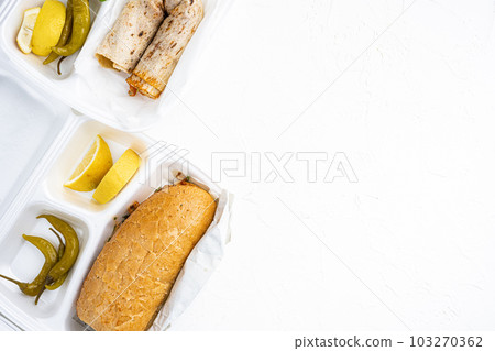 Somun ekmek tavuk tantuni Chicken Turkish doner kebab durum, on white stone table background, top view flat lay, with copy space for text Somun ekmek tavuk tantuni Chicken Turkish doner kebab durum, on white stone table background, top view flat lay, with copy space for text 103270362