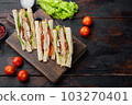 Homemade chicken sandwich, on old wooden table, top view with copy space for text 103270401