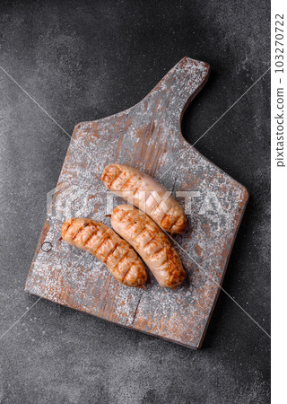 Delicious grilled sausages from chicken or pork meat with salt, spices and herbs Delicious grilled sausages from chicken or pork meat with salt, spices and herbs 103270722