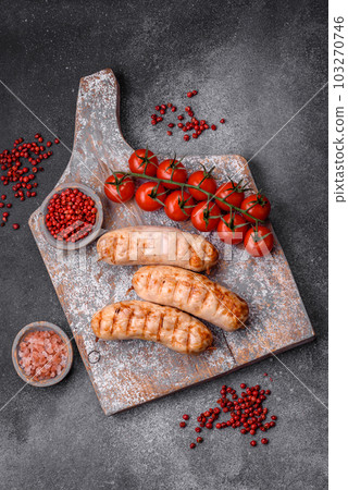 Delicious grilled sausages from chicken or pork meat with salt, spices and herbs 103270746