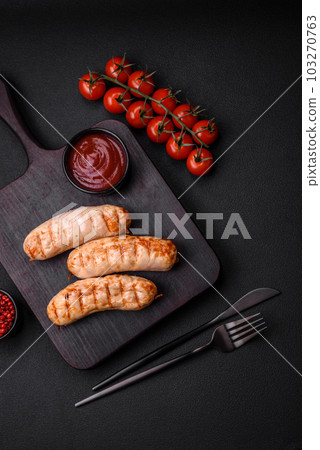 Delicious grilled sausages from chicken or pork meat with salt, spices and herbs 103270763