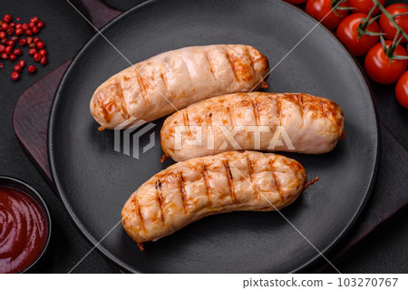 Delicious grilled sausages from chicken or pork meat with salt, spices and herbs Delicious grilled sausages from chicken or pork meat with salt, spices and herbs 103270767