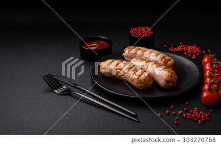 Delicious grilled sausages from chicken or pork meat with salt, spices and herbs 103270768