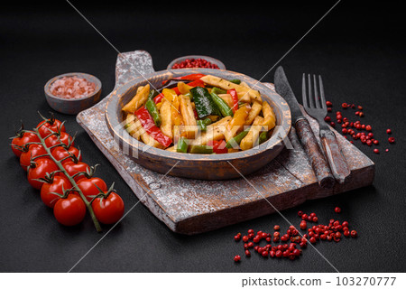 Delicious fried potatoes with bell peppers, asparagus beans, salt and spices 103270777