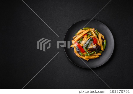 Delicious fried potatoes with bell peppers, asparagus beans, salt and spices 103270791