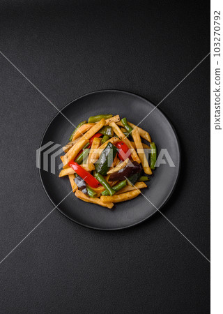 Delicious fried potatoes with bell peppers, asparagus beans, salt and spices 103270792