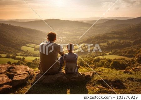 Father and son gazing at magnificent natural scenery Father and son gazing at magnificent natural scenery 103270929