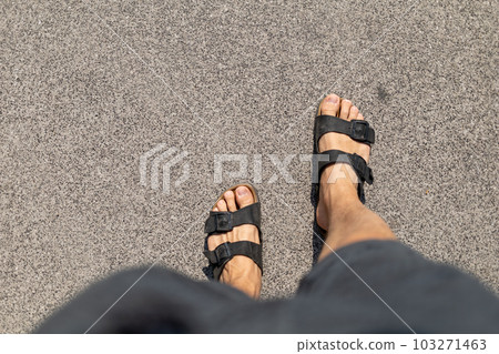 Male feet in slippers view from above Male feet in slippers view from above 103271463