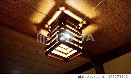 A red light bulb in an old folk house 103271532