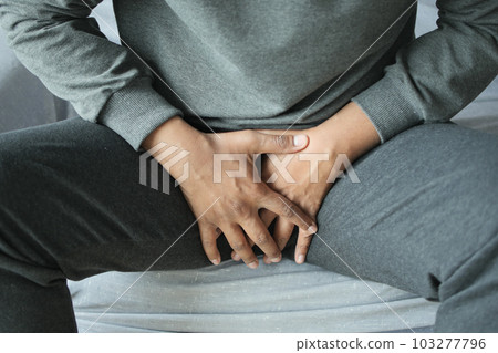 the concept of prostate and bladder problem, crotch pain of a young person the concept of prostate and bladder problem, crotch pain of a young person 103277796