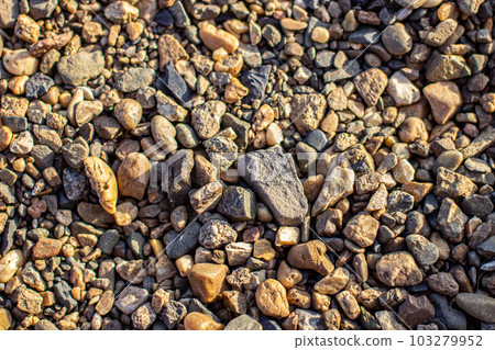 Background of small pebbles and stones on the seashore or in garden 103279952