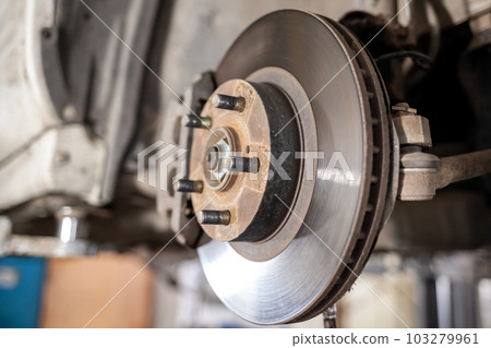 Disc brake of the vehicle for repair, in process of tire replacement 103279961
