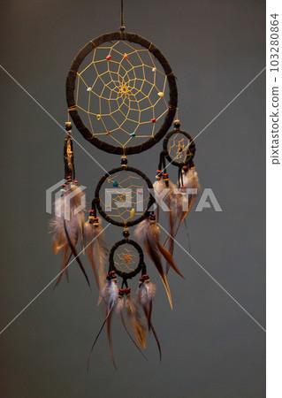 Dreamcatcher hanging in a dark room Dreamcatcher hanging in a dark room 103280864
