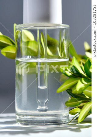 Serum with a dropper with spring flowers. Serum with a dropper with spring flowers. 103281753