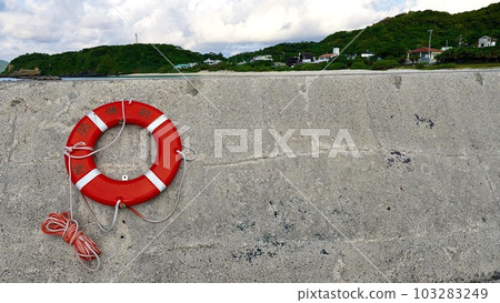 Embankment and lifesaving equipment of a fishing port on the foreshore of Aka Island, Okinawa Prefecture 103283249