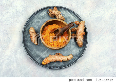 Turmeric root and turmeric powder, medicine herb. Turmeric root and turmeric powder, medicine herb. 103283646