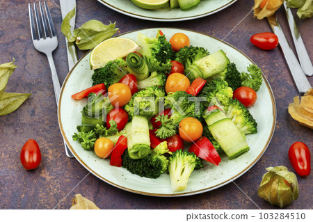 Spring appetizing salad decorated with physalis. 103284510