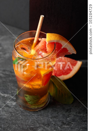 Summer refreshing drink with ice, mint, and grapefruit. Summer refreshing drink with ice, mint, and grapefruit. 103284729