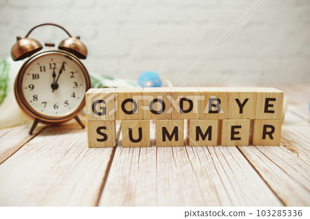 Goodbye Summer alphabet letter and alarm lock decoration on wooden background Goodbye Summer alphabet letter and alarm lock decoration on wooden background 103285336
