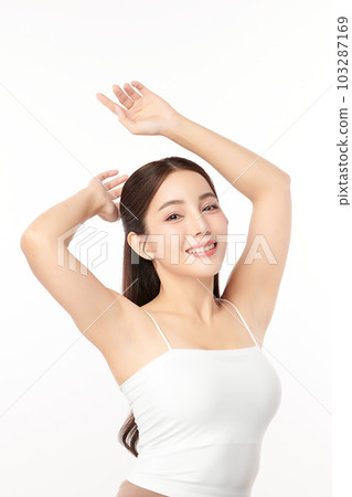 Beautiful Young Asian woman lifting hands up to show off clean and hygienic armpits or underarms on white background, Smooth armpit cleanliness and protection concept Beautiful Young Asian woman lifting hands up to show off clean and hygienic armpits or underarms on white background, Smooth armpit cleanliness and protection concept 103287169