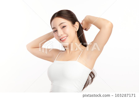 Beautiful Young Asian woman lifting hands up to show off clean and hygienic armpits or underarms on white background, Smooth armpit cleanliness and protection concept Beautiful Young Asian woman lifting hands up to show off clean and hygienic armpits or underarms on white background, Smooth armpit cleanliness and protection concept 103287171