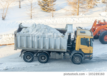 Cleaning and cleaning of roads in the city from snow in winter 103289160