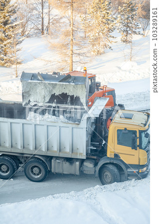 Cleaning and cleaning of roads in the city from snow in winter 103289161