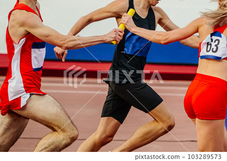 mixed track and field team running relay race in summer athletics championships 103289573