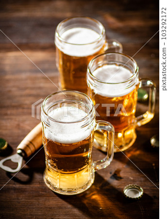 Glasses with fresh beer. 103292172