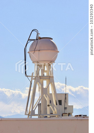 Spherical tank water tower on the roof of a building 103293340