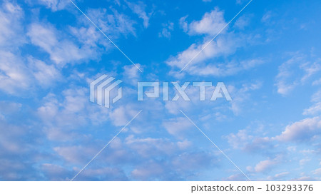 white clouds in the evening sky 103293376