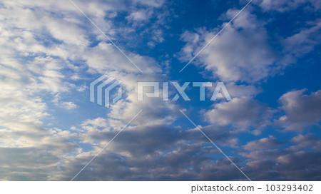 white clouds in the evening sky 103293402