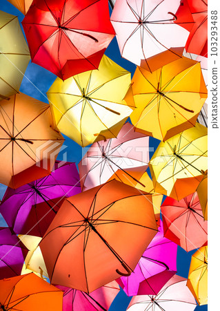 Colorful Umbrellas Hanging As Street Decoration And Sun Protection In The City Of Bordeaux, France Colorful Umbrellas Hanging As Street Decoration And Sun Protection In The City Of Bordeaux, France 103293488