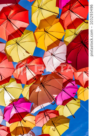 Colorful Umbrellas Hanging As Street Decoration And Sun Protection In The City Of Bordeaux, France Colorful Umbrellas Hanging As Street Decoration And Sun Protection In The City Of Bordeaux, France 103293496