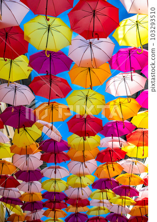 Colorful Umbrellas Hanging As Street Decoration And Sun Protection In The City Of Bordeaux, France Colorful Umbrellas Hanging As Street Decoration And Sun Protection In The City Of Bordeaux, France 103293510